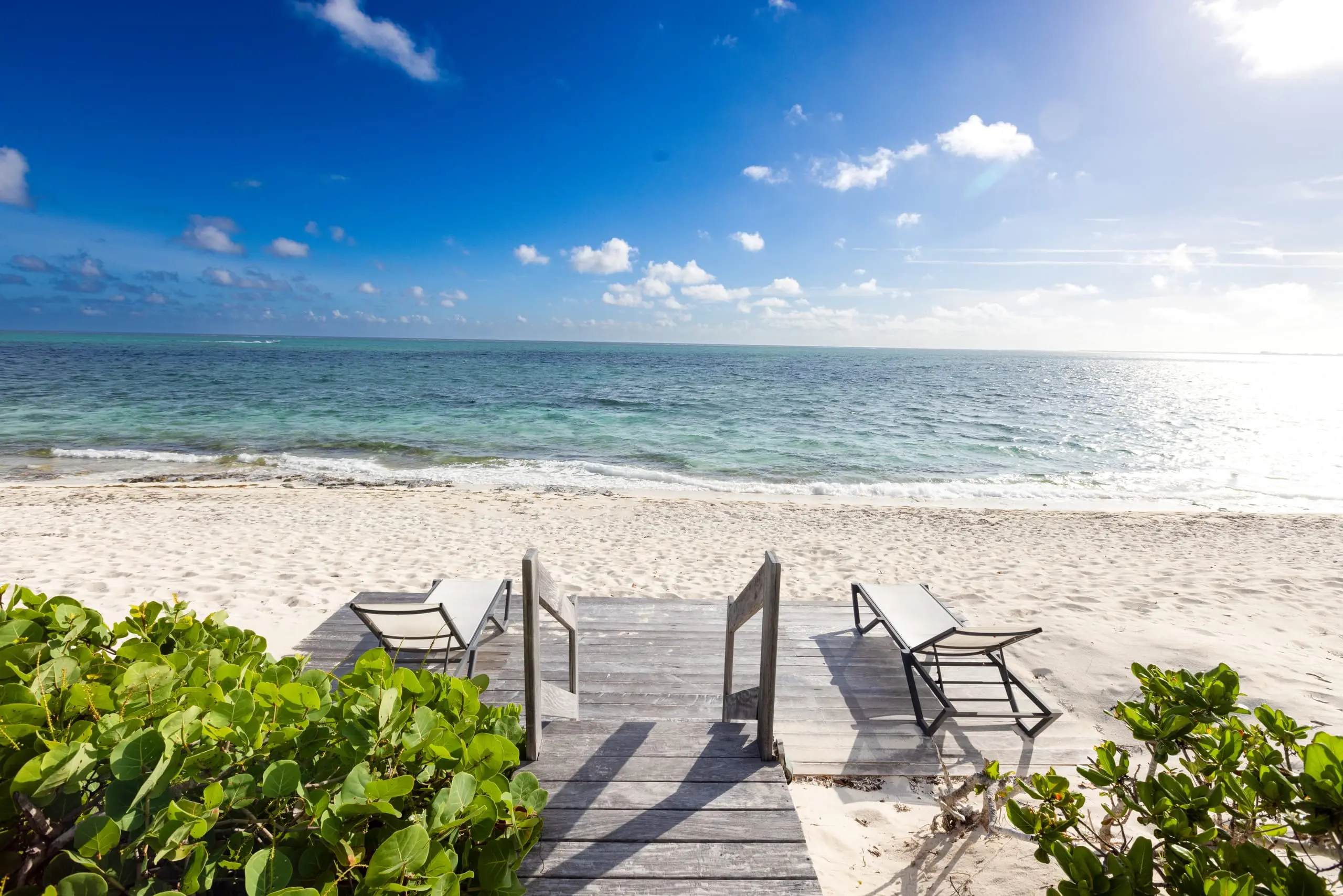 The beach deck and the quiet shore of Grace Bay