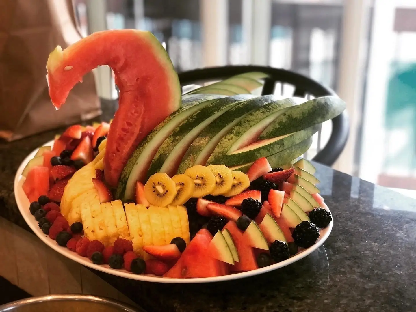 A fruit platter carved into a swan