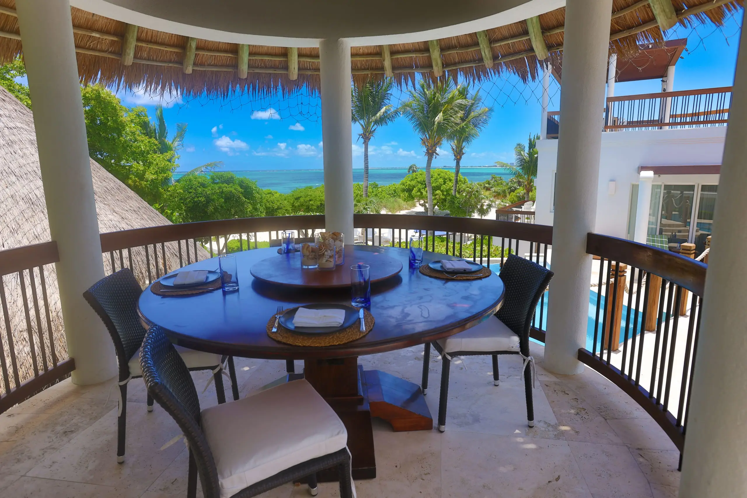 The gazebo dining table overlooking the ocean