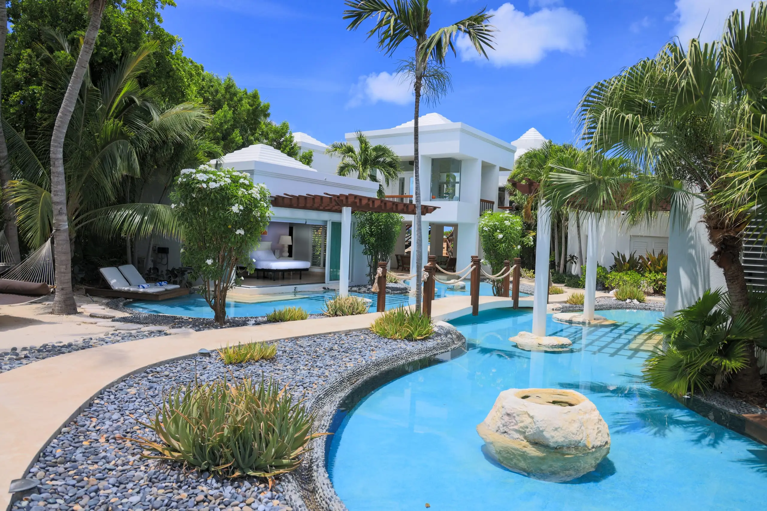 The lagoon pool winding through the gardens